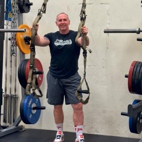 Caulfield standing in weight room