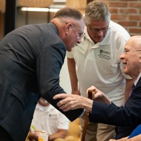 President, LtGen Broadmeadow '83, USMC (Ret.) (Left), Phil Susmann – President of NUARI (Center), and retired US Senator Patrick Leahy (seated Right)